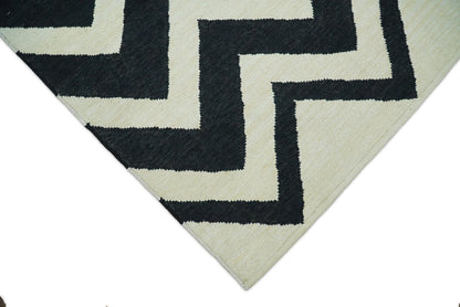 Black and Beige Chevron Design Hand Woven Dhurrie Rug.