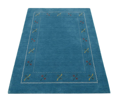 Blue And White Gabbeh Border Design Hand Loomed Wool Area Rug.