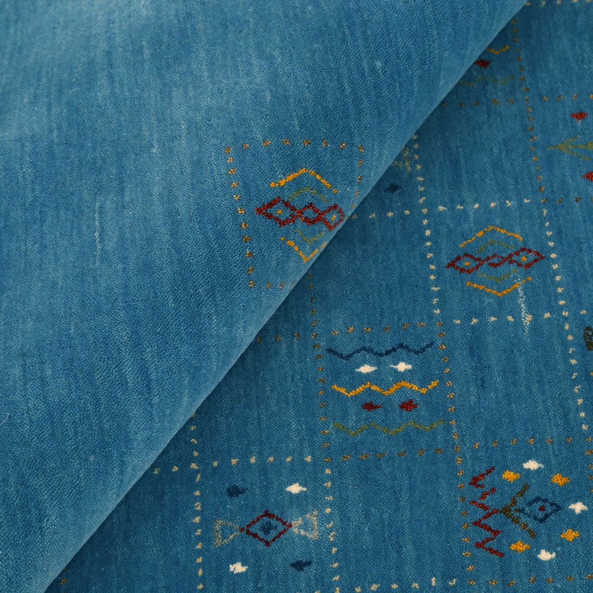 Blue Tribal Design Hand Loomed Wool Area Rug.