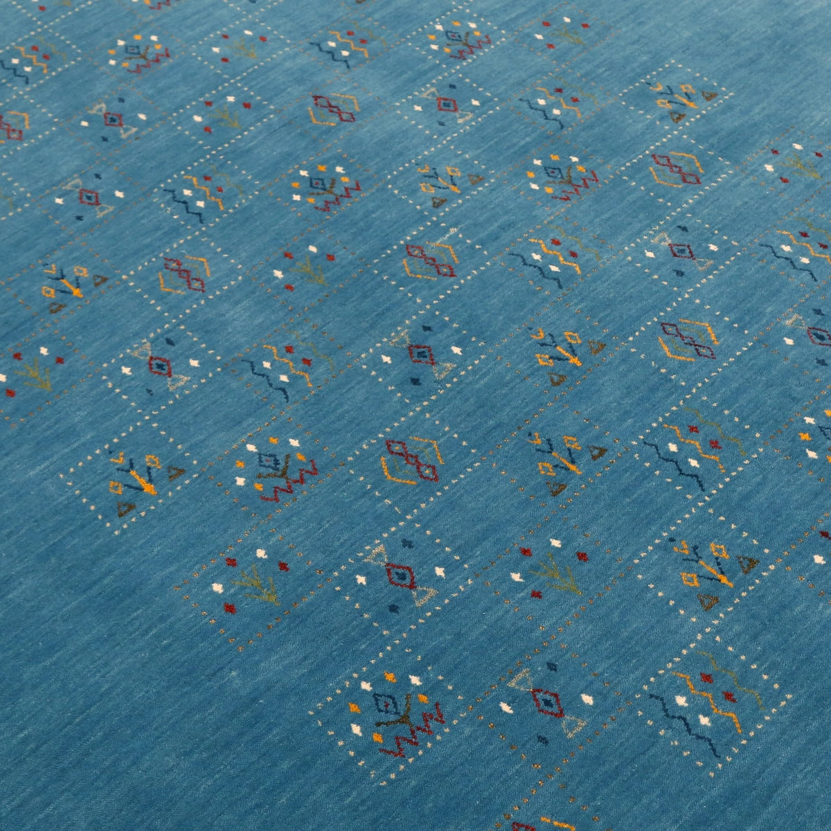 Blue Tribal Design Hand Loomed Wool Area Rug.