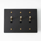Residence Supply Night Black with Brass Brass Toggle Switch (3-Gang)