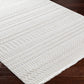 Cira Ivory Textured Area Rug with Fringes.