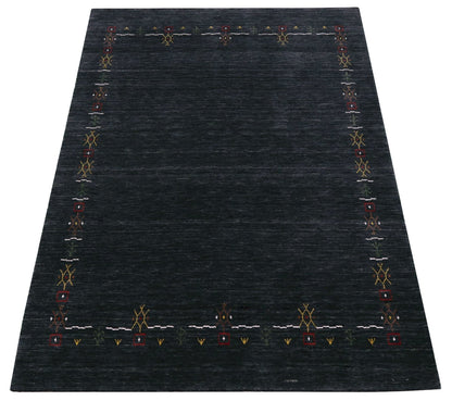Charcoal Tribal Design Border Hand Loomed Wool Area Rug.