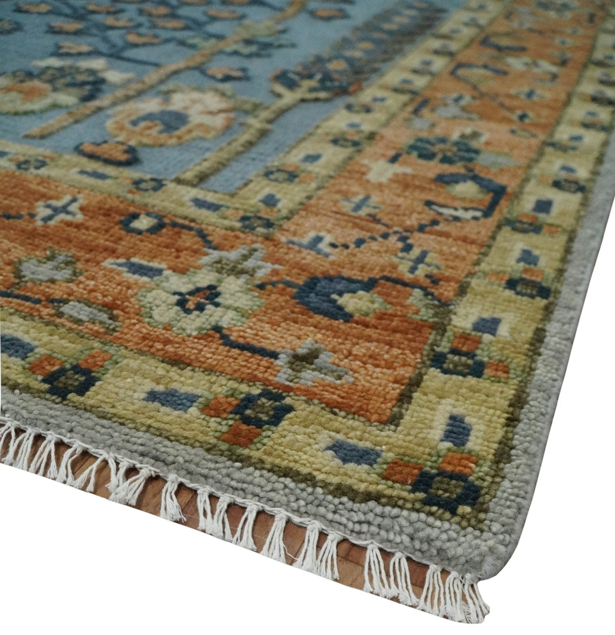 Custom Made Hand Knotted Blue and Rust Tree Design Low pile Wool Area Rug.