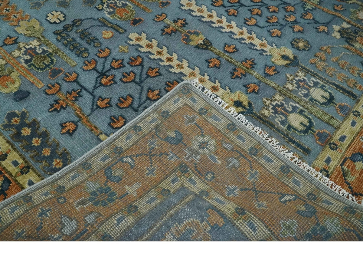 Custom Made Hand Knotted Blue and Rust Tree Design Low pile Wool Area Rug.