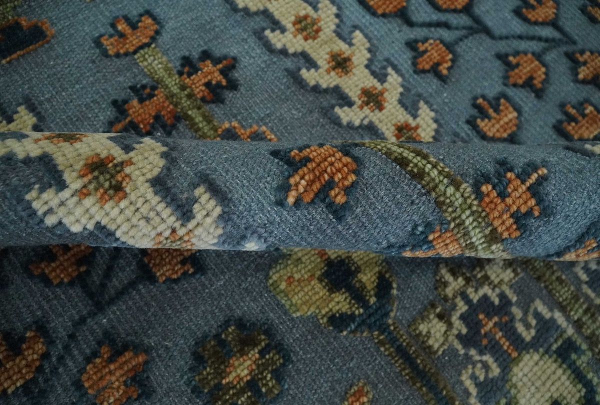 Custom Made Hand Knotted Blue and Rust Tree Design Low pile Wool Area Rug.