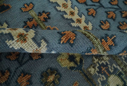 Custom Made Hand Knotted Blue and Rust Tree Design Low pile Wool Area Rug.
