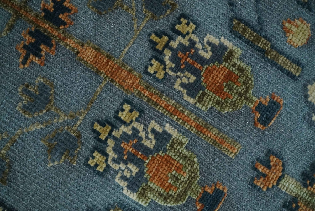 Custom Made Hand Knotted Blue and Rust Tree Design Low pile Wool Area Rug.