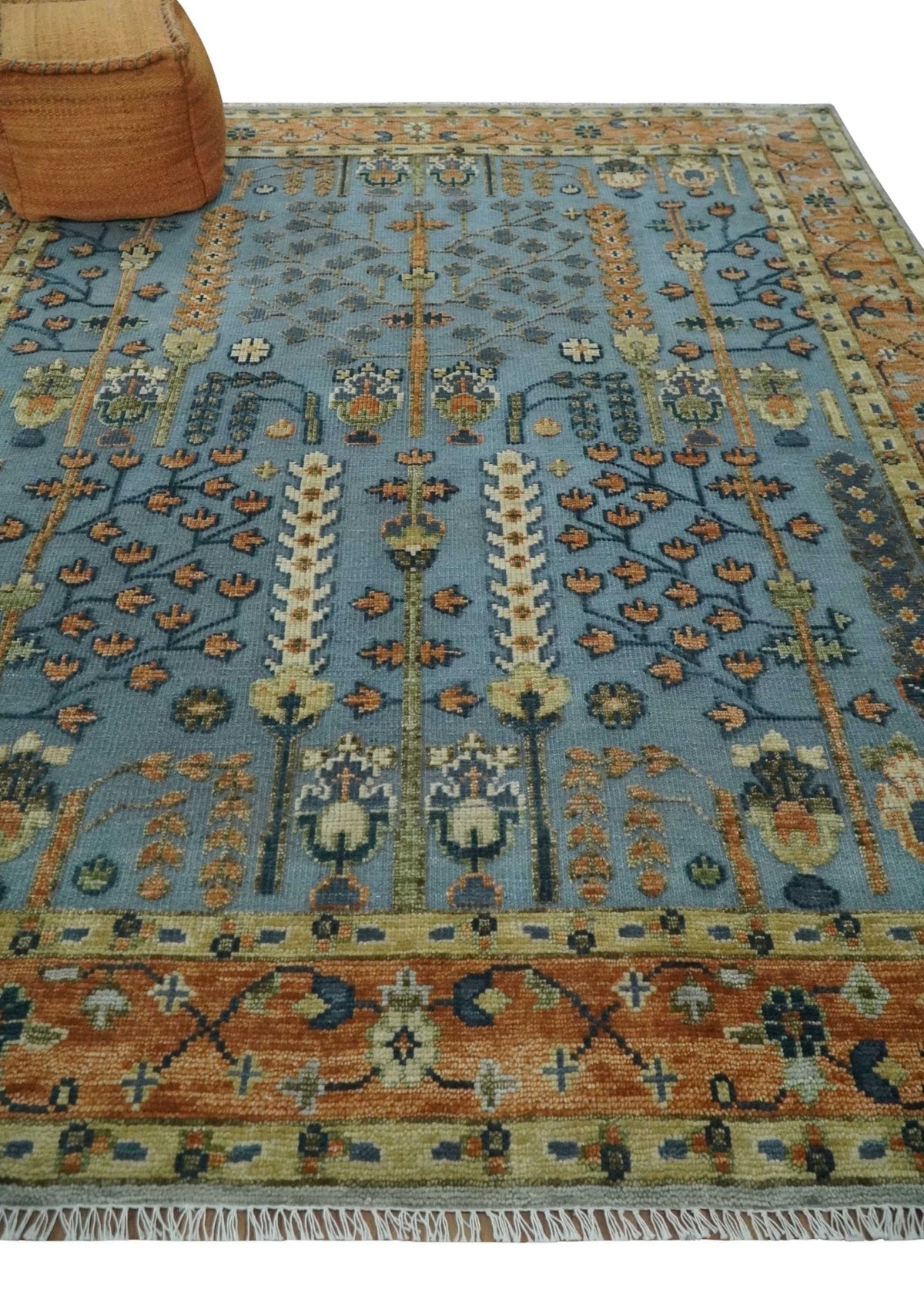 Custom Made Hand Knotted Blue and Rust Tree Design Low pile Wool Area Rug.