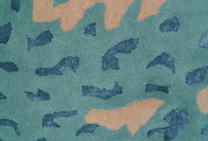 Custom Made Modern Animal Pattern Teal And Beige Hand Tufted Wool Area Rug.