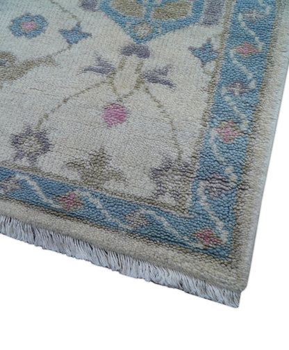 Custom Made Traditional Style Ivory And Blue Hand Knotted Wool Area Rug.