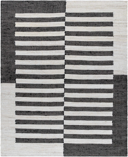 Rug with black and white striped pattern