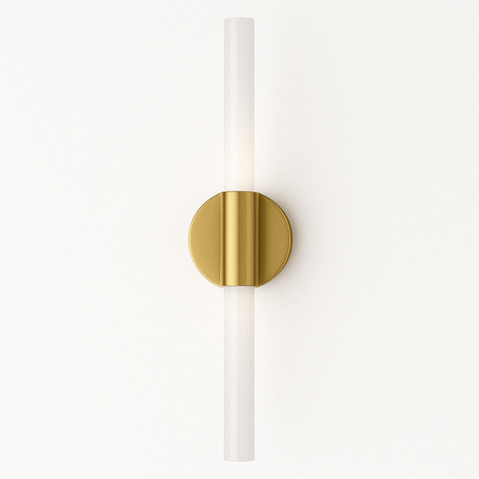 Wall sconce with gold fixture and white cylindrical shade on a white background