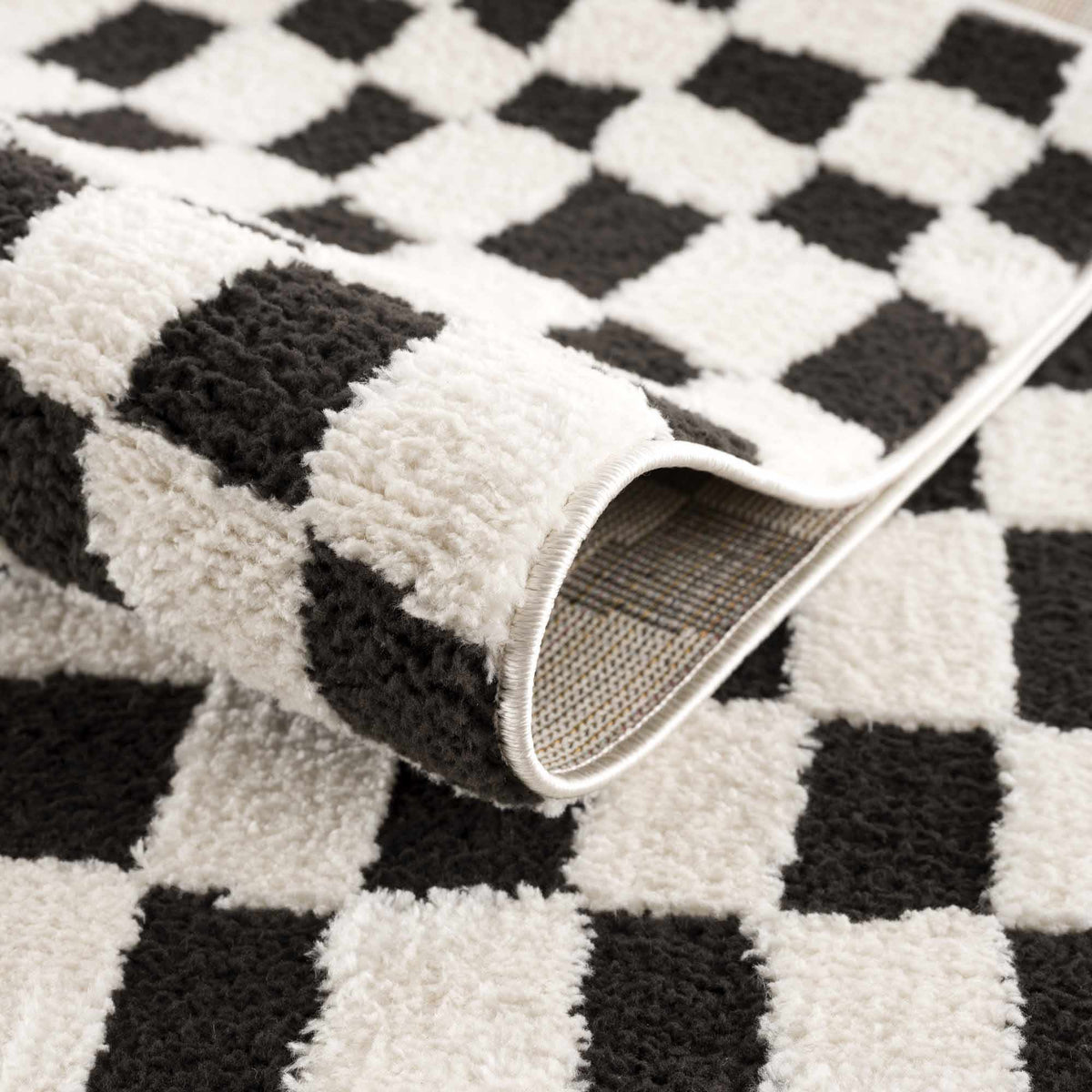 Lajos Black & White Checkered Plush Rug.