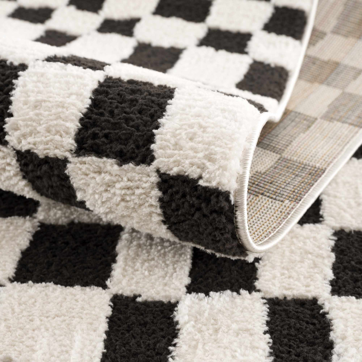 Lajos Black & White Checkered Plush Rug.