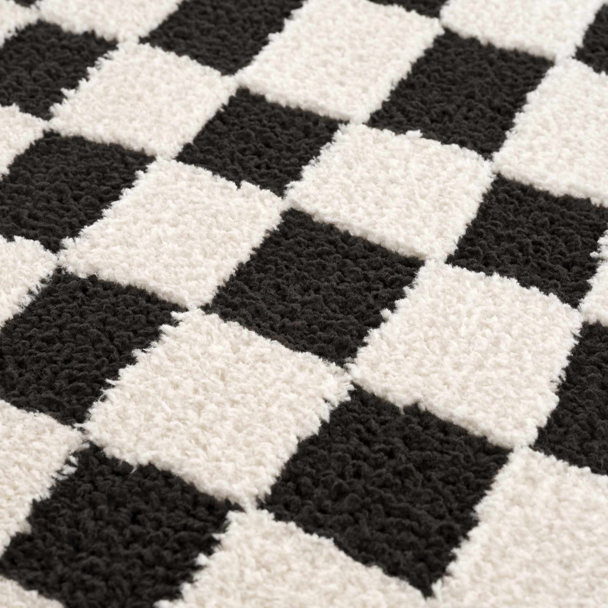 Lajos Black & White Checkered Plush Rug.