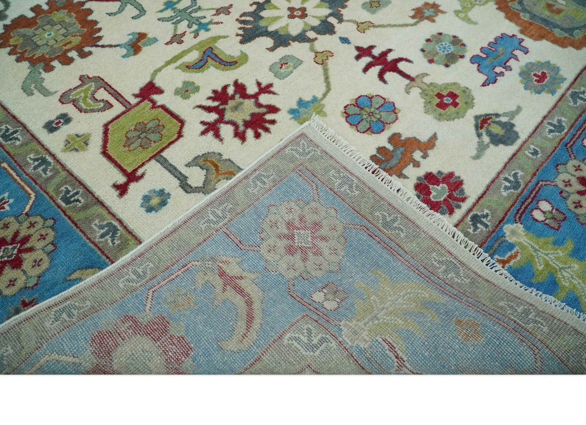 Fine Traditional Ivory and Blue Colorful Hand knotted Oushak Wool Area Rug.