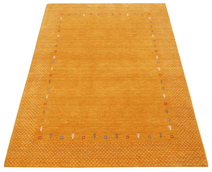 Gold Tribal Border Design Hand Loomed Wool Area Rug.