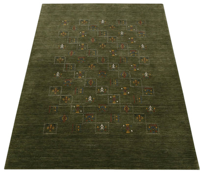 Green Tribal Design Hand Loomed Wool Area Rug.