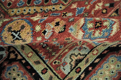 Hand Knotted Traditional Kazak Medallion Rust and Black Wool Area Rug.