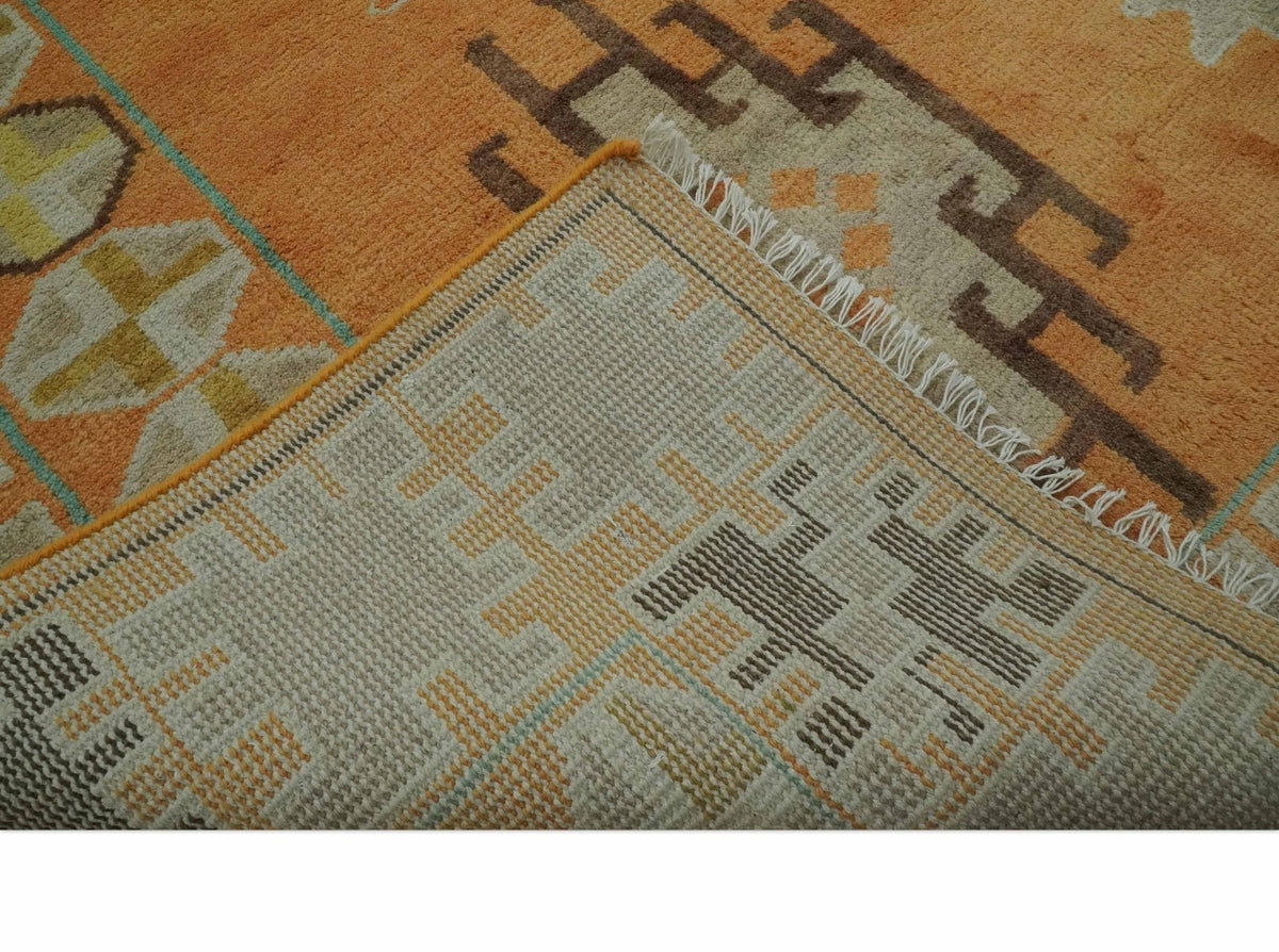 Hand Knotted Peach and Beige Traditional Southwestern Multi Size wool area rug.
