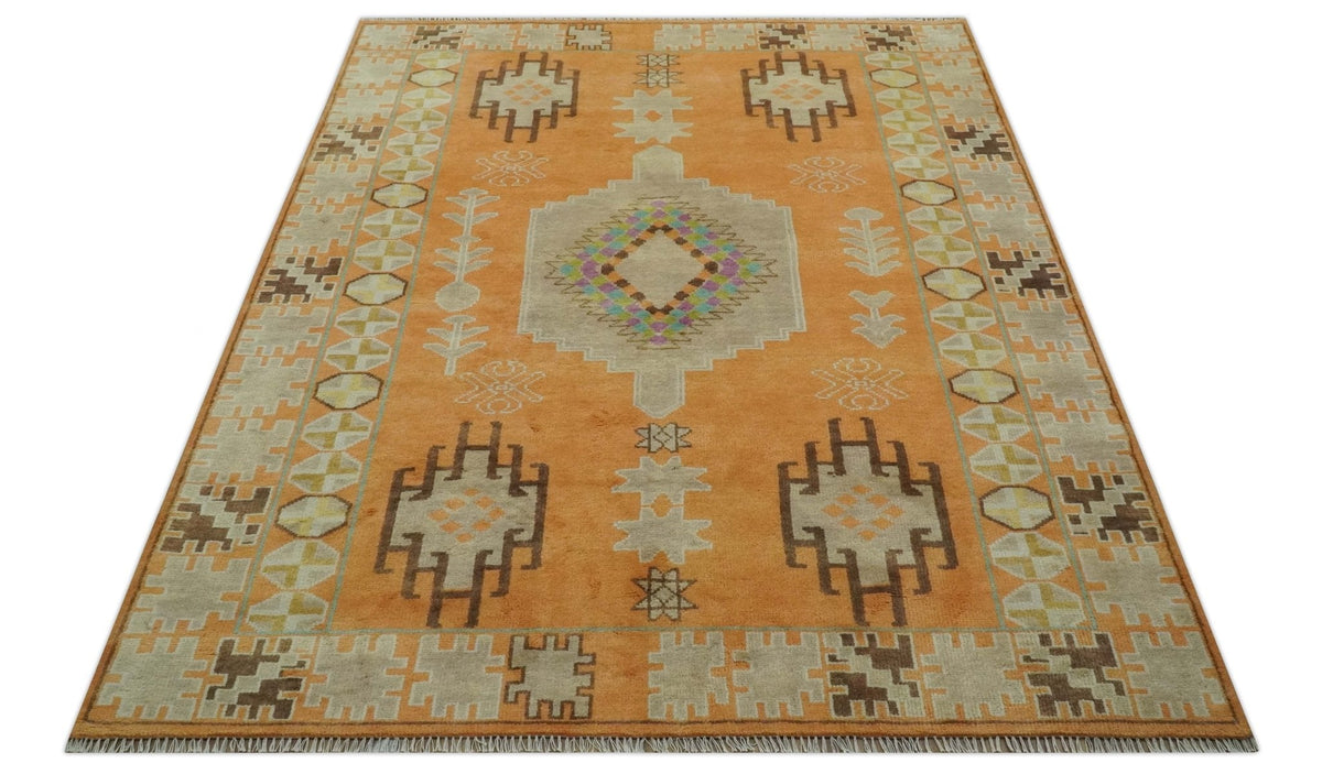 Hand Knotted Peach and Beige Traditional Southwestern Multi Size wool area rug.