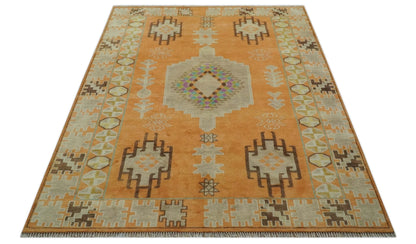 Hand Knotted Peach and Beige Traditional Southwestern Multi Size wool area rug.