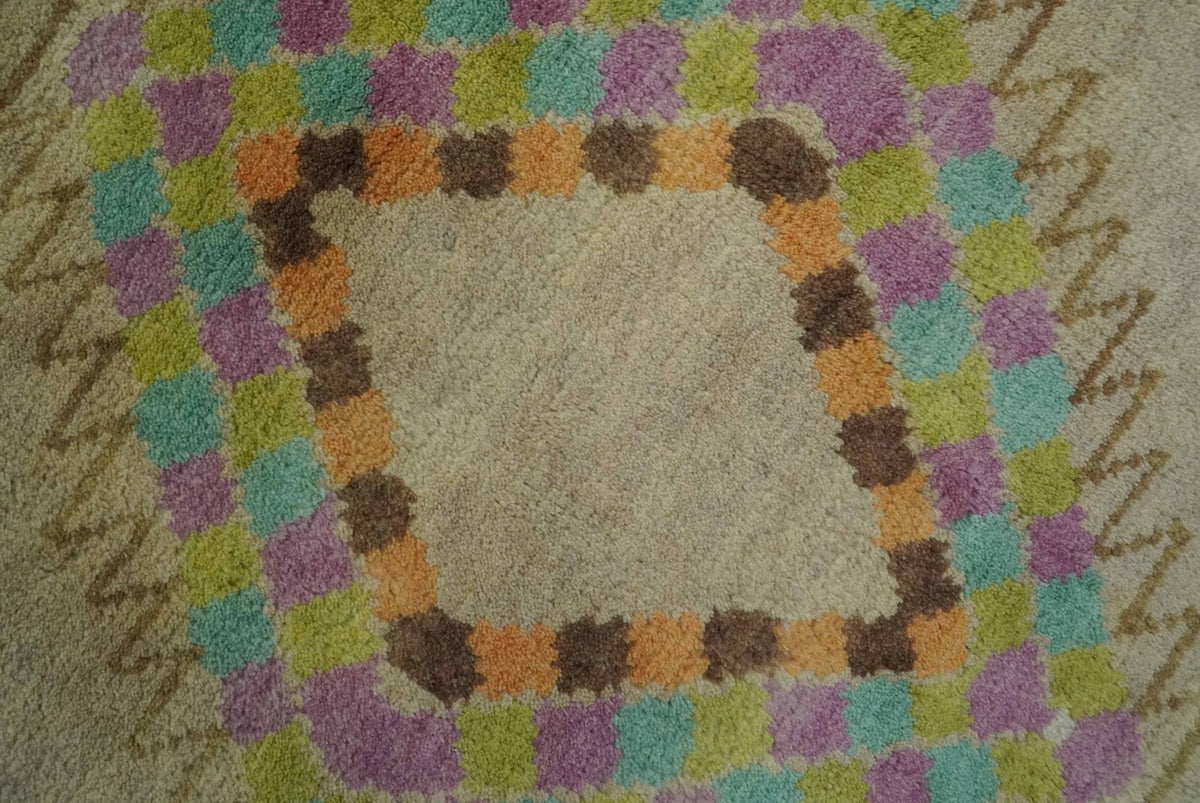 Hand Knotted Peach and Beige Traditional Southwestern Multi Size wool area rug.