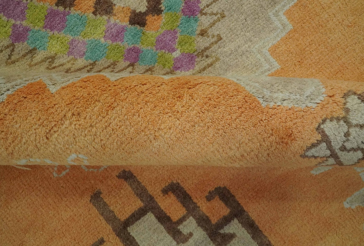 Hand Knotted Peach and Beige Traditional Southwestern Multi Size wool area rug.
