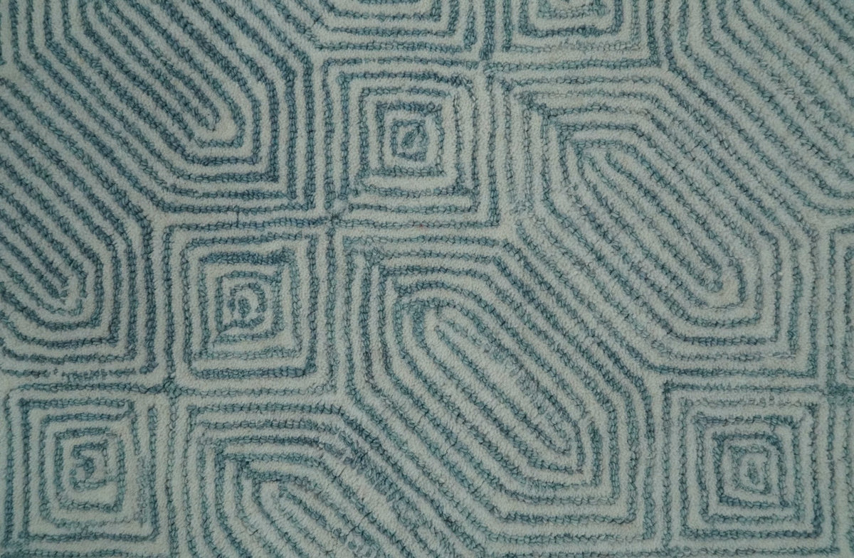 Modern Contemporary Style Teal and Ivory Hand Tufted Wool Area Rug.