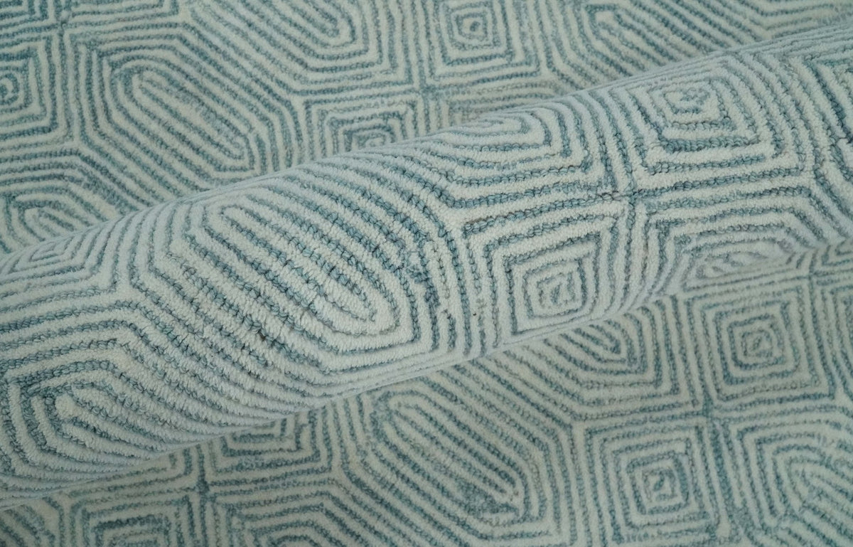 Modern Contemporary Style Teal and Ivory Hand Tufted Wool Area Rug.