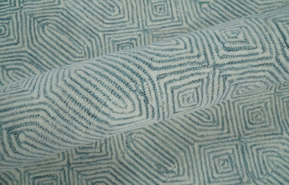 Modern Contemporary Style Teal and Ivory Hand Tufted Wool Area Rug.