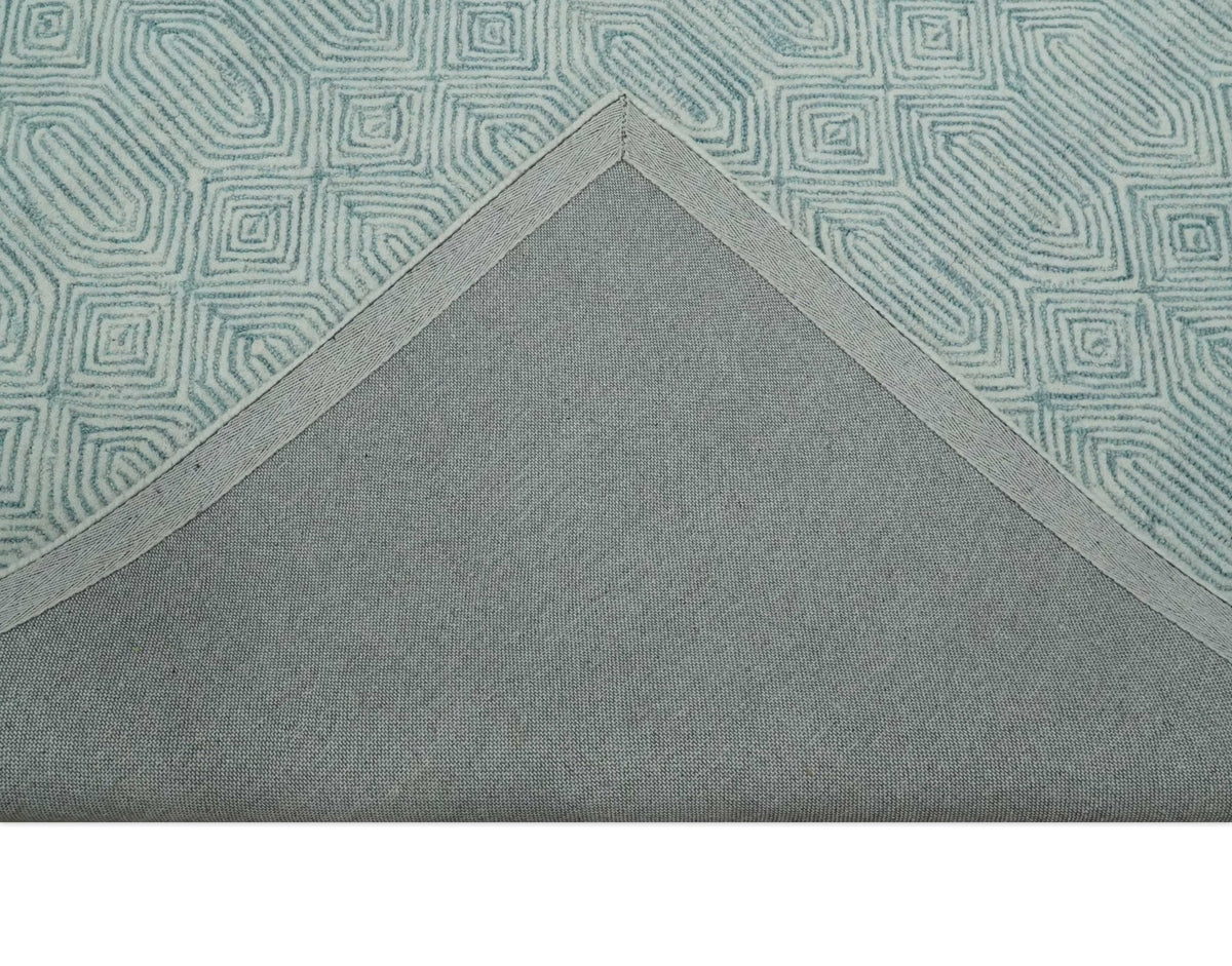 Modern Contemporary Style Teal and Ivory Hand Tufted Wool Area Rug.