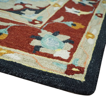 Hand Tufted Black, Rust and Beige Persian Style Wool Area Rug.