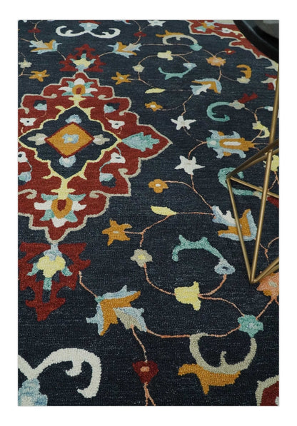 Hand Tufted Black, Rust and Beige Persian Style Wool Area Rug.