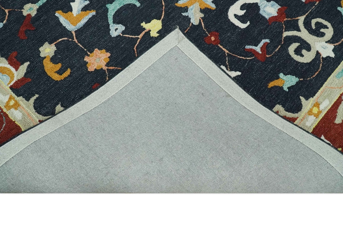 Hand Tufted Black, Rust and Beige Persian Style Wool Area Rug.