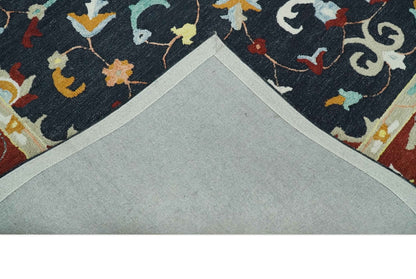 Hand Tufted Black, Rust and Beige Persian Style Wool Area Rug.