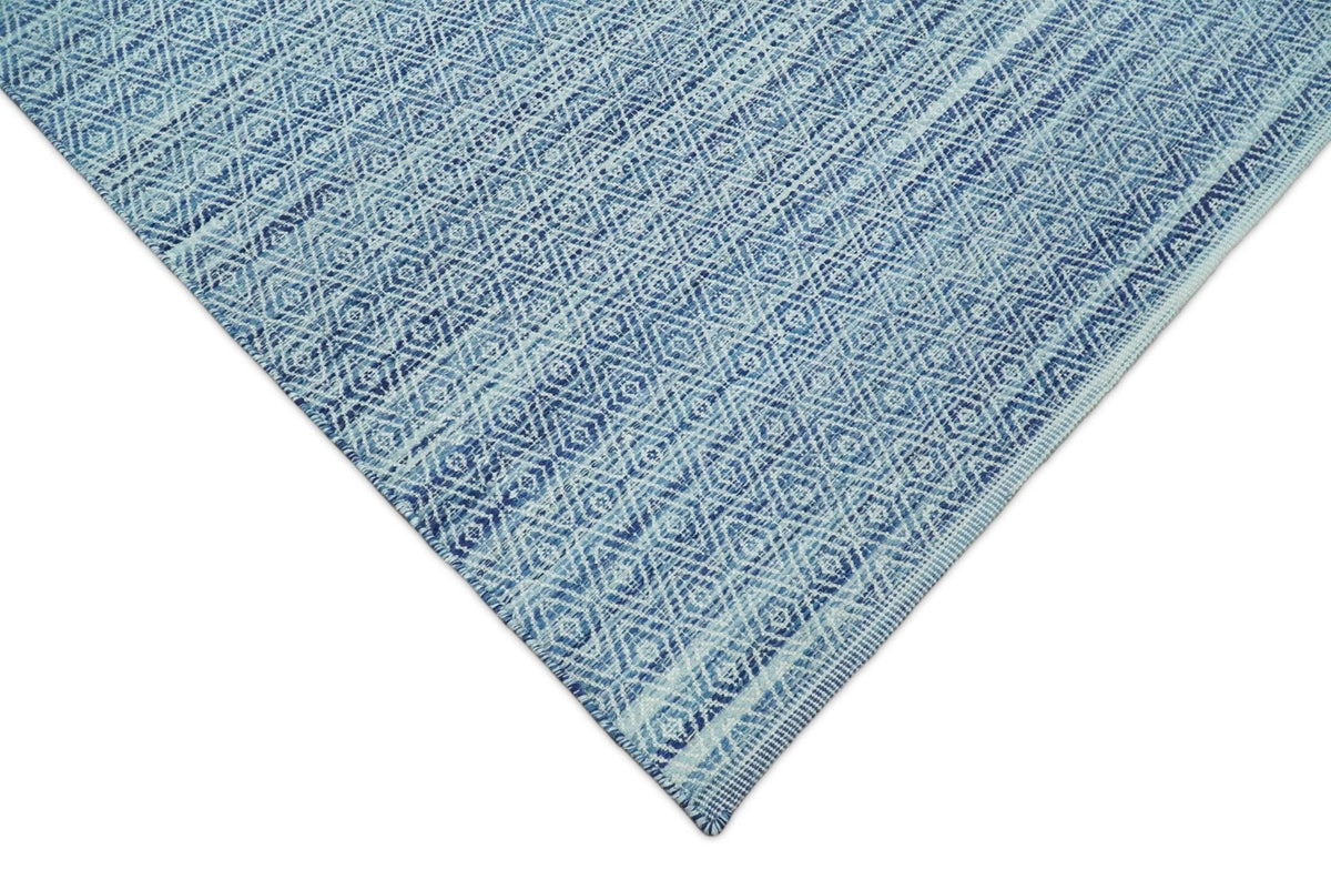 Handmade Boho Ivory and Blue Wool Blend Dhurrie Rug.