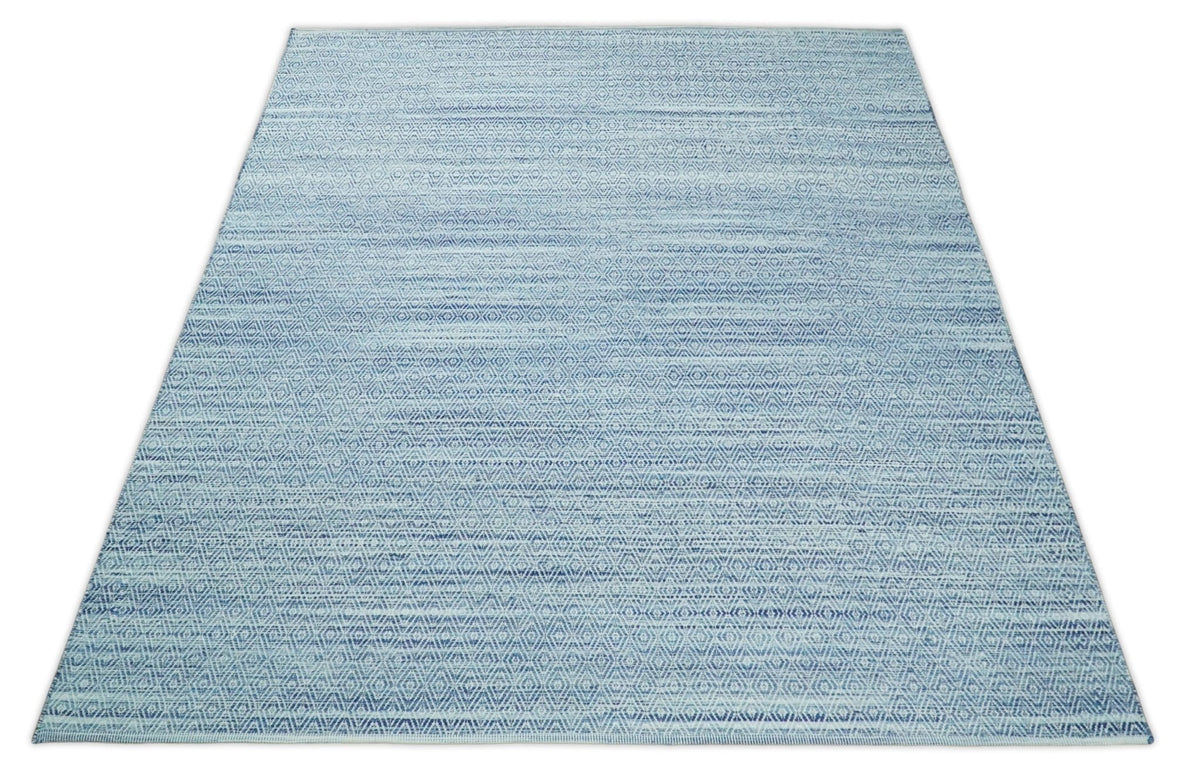 Handmade Boho Ivory and Blue Wool Blend Dhurrie Rug.