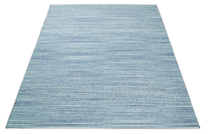 Handmade Boho Ivory and Blue Wool Blend Dhurrie Rug.