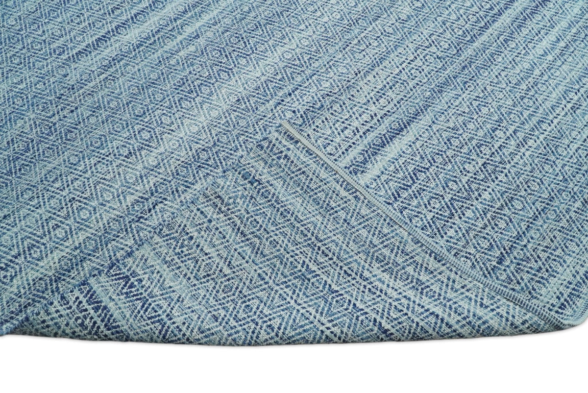 Handmade Boho Ivory and Blue Wool Blend Dhurrie Rug.