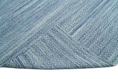 Handmade Boho Ivory and Blue Wool Blend Dhurrie Rug.
