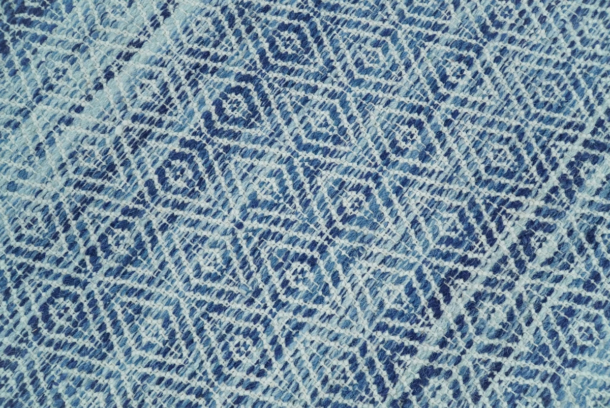 Handmade Boho Ivory and Blue Wool Blend Dhurrie Rug.