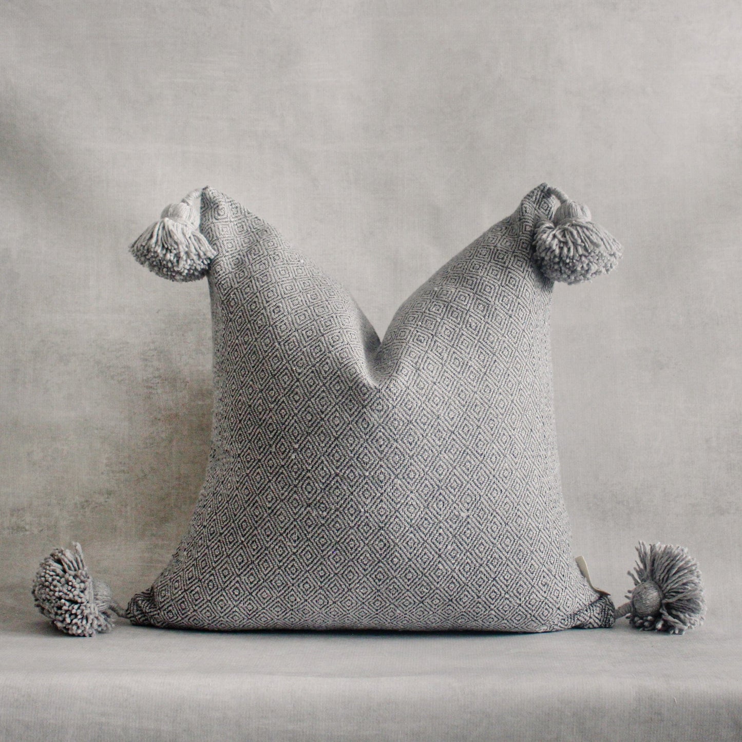 RuffledThread Home & Living > Home Décor > Decorative Pillows 20 in X 20 in No. 1 Handmade Moroccan Pom Pom Pillow Cover