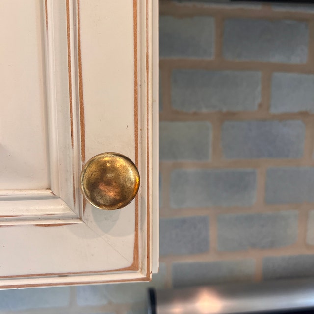 Round "Capri" Antique Brass Cabinet Knob.