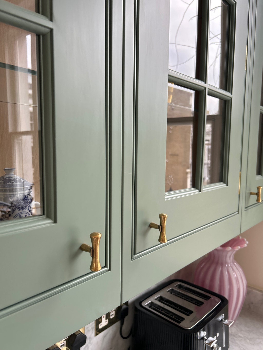 Hourglass "Tuscany" Drawer Pulls and Knobs in Antique Brass.