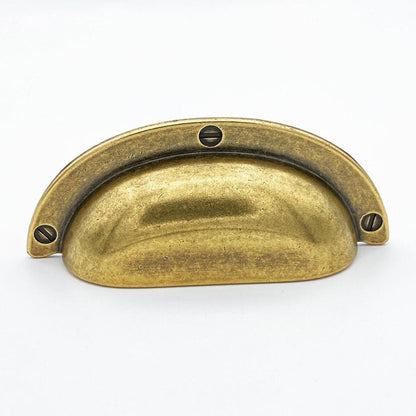 Cup Drawer Pulls "Amalfi" in Antique Brass.