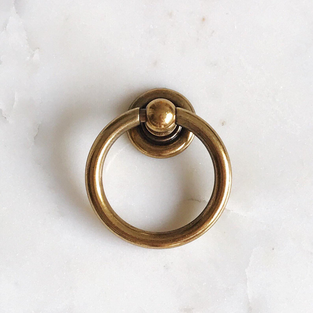 Plain Antique Brass "Capri" Ring Drawer Pulls.