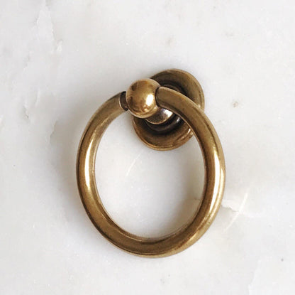 Plain Antique Brass "Capri" Ring Drawer Pulls.