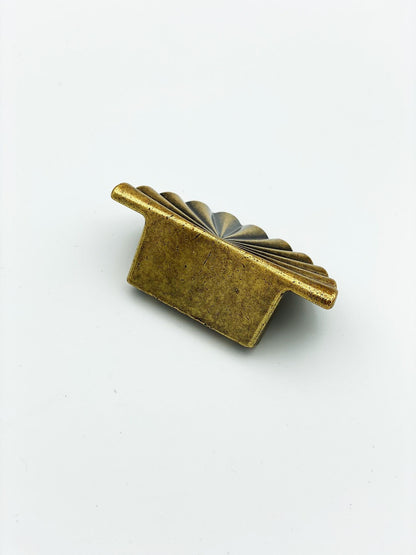 Reeded Antique Brass "Half-Daisy" Round Cabinet Knob.